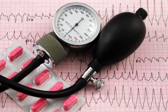 A blood pressure monitor and pills
