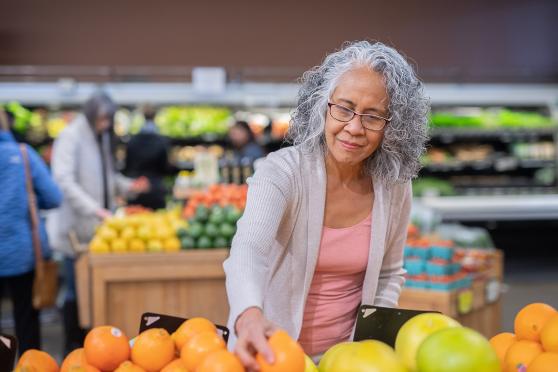 A senior grocery shops for healthy foods