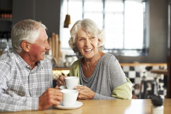 a senior couple drinks coffee