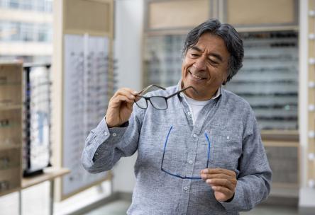 Senior picking glasses