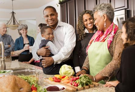 A family gathers in the kitchen