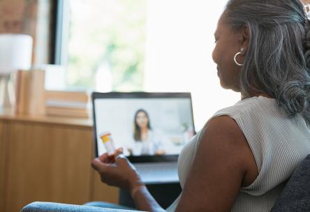 Woman using telehealth services