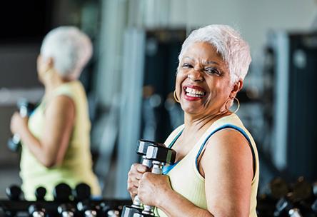 A woman holding dumbbells. 