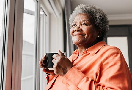 woman looking out window 