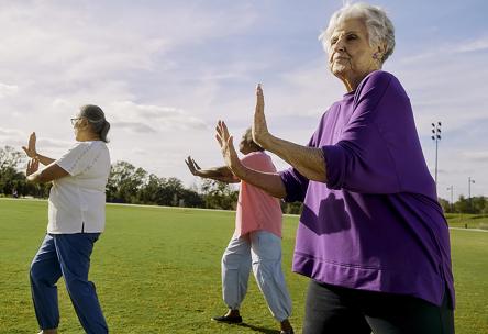 Senior women practice Tai Chi