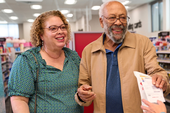 A man and a woman at a pharmacy