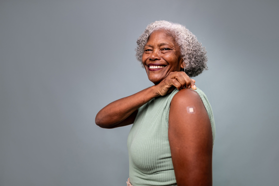 A woman with a bandage on her arm.