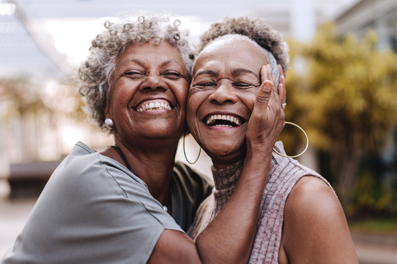Two women hugging.