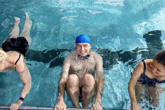 Three people exercising in a pool