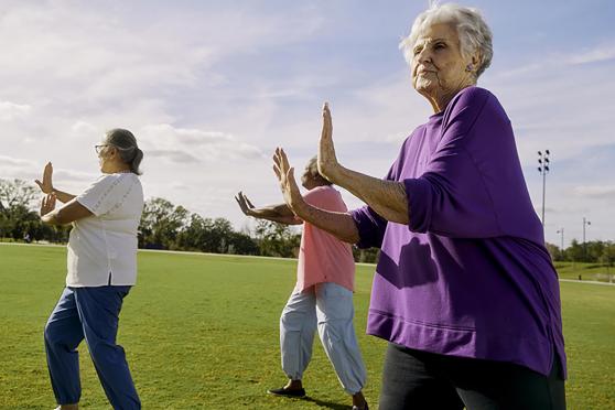 Senior women practice Tai Chi