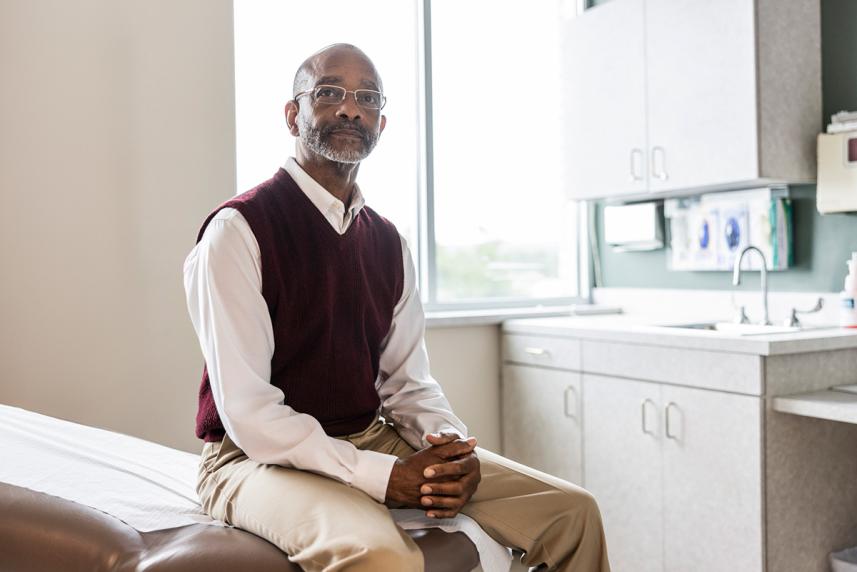 Man waiting for doctor in exam room
