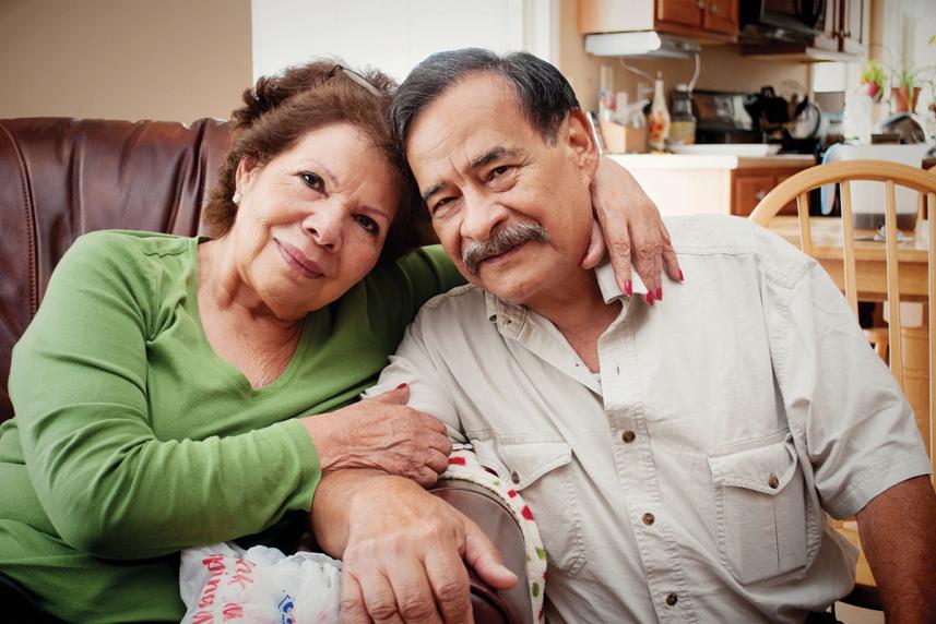 older couple sitting on couch