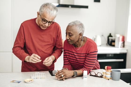 Older couple organizing medications