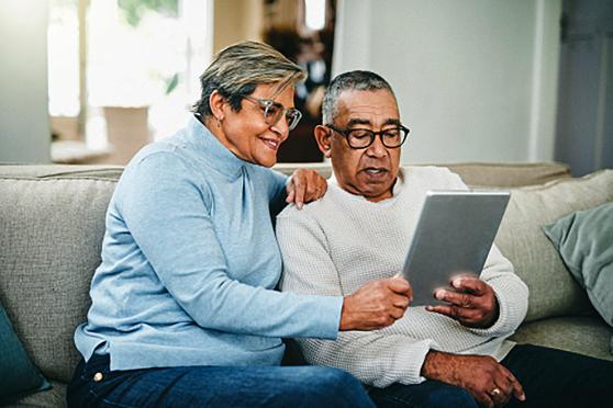 Couple reading tablet